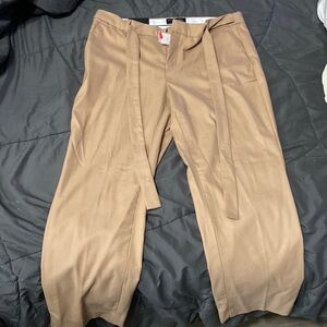 Mid rise work pants. Straight fit through hip and thigh @ ankle length